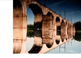 my-photo-of-the-railroad-bridge-near-Yardley-Pennsylvania--and-it-allows-trains-to-cross-between-Pennsylvania-and-New-Jersey--and-there--is-a-perfect-reflection-of-the-oval-arches-of-the-tan-stones-of-the-bridge-in-the-placid-Delaware-River-making-it-hard-to-tell-if-the-photo-is-upside-down-or-right-side-up"