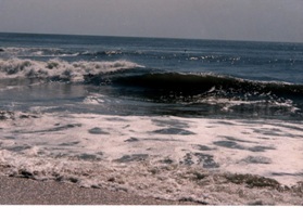 my-photo-of-bright-blue-waves--as-they-crash-over-a-sand-bar-and-the-sky-above-is-very-blue"